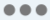 Three dancing gray dots.